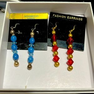Two pair of gold plated long dangling earrings